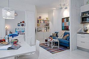 Šarmanten beli apartma z barvnimi poudarki na Švedskem