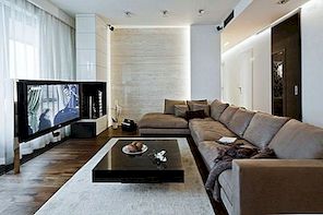 En modern lägenhet i Polen med en varm inredning och en jordig färgpalett