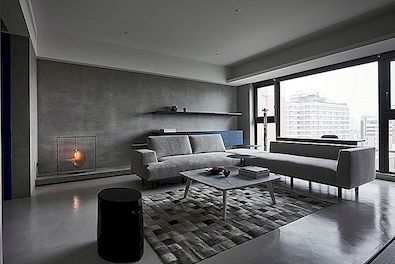 Modern lägenhet med låg profil, elegant och balanserad inredning