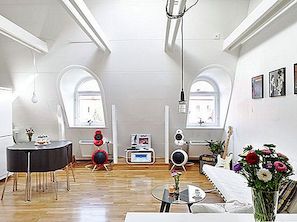 Enkelhet och mångfald i en elegant liten vindsvåning lägenhet