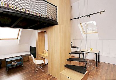 Klein appartement met een slaapkamer op de vliering en een licht open plan