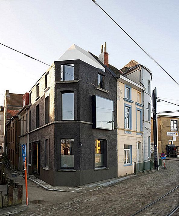 Indrukwekkende restauratie van een 19e eeuws hoekgebouw in Gent, België