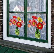 Vlakke bloemen om je Windows te versieren